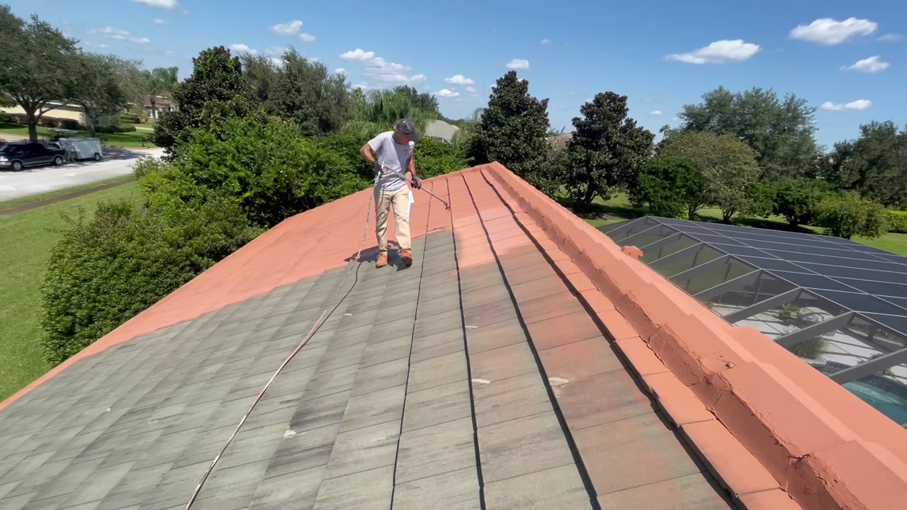 Crew coating roof with pool cage and Florida scenery